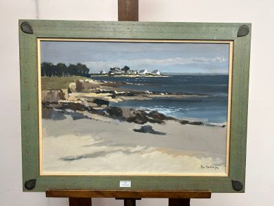 a painting on a easel with a picture of a beach