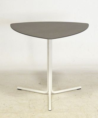 a close up of a table with a white base and a black top