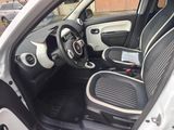 the interior of a small car with black and white trims