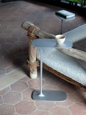a small table with a cup of coffee on it