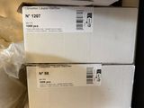 boxes stacked on top of each other on a shelf in a room