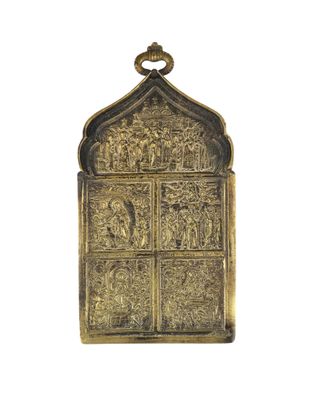 an old brass door with a window and a cross on it