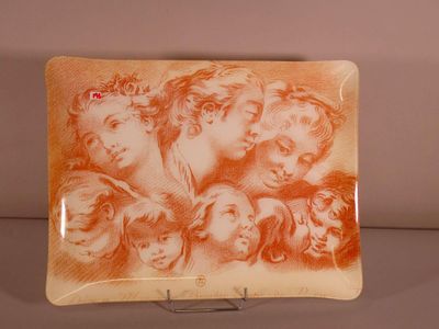 a plate with a picture of a group of people on it