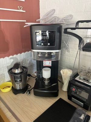 a coffee maker and blender on a counter in a kitchen