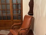 a brown chair and a brown chair in a room