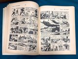 an old comic book opened to a page with a picture of a plane