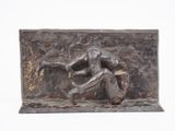 statue of a man holding a baseball bat on a stone block