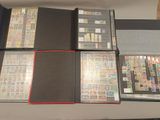 a lot of different stamps on a table together
