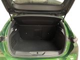 a green car with its trunk open on a white background