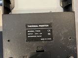 an image of a thermal printer that is sitting on a table