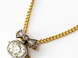 an image of a diamond and gold necklace on a gold chain