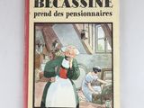 un livre sur lequel figure la photo d'une femme dans une cuisine
