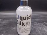 a bottle of liquid that is sitting on a table