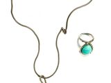 an image of a necklace and earring set on a white background