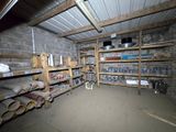 a room that has a lot of shelves in it