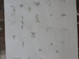 a piece of paper with drawings on it sitting on a table