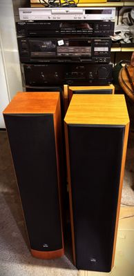two speakers sitting next to each other on the floor