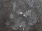 a close up of a metal object with a hole in it