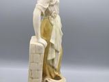 an image of a statue of a woman with a bucket of water