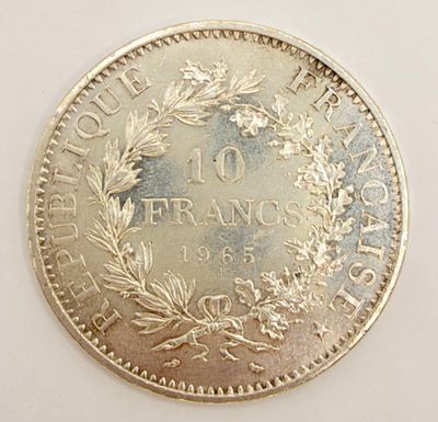 a close up of a coin on a white surface
