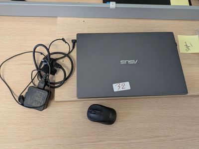 a laptop and a mouse on a table