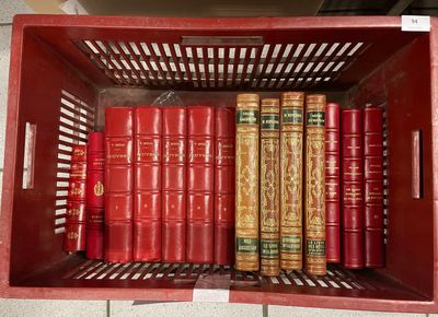 many books in a red box on the shelf