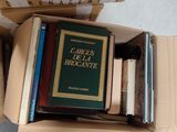 a box full of books sitting on the floor