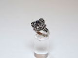 a ring that is sitting on top of a glass