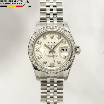 an image of a rolex watch with diamonds on the dial