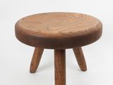 an image of a small wooden stool sitting on top of a white surface