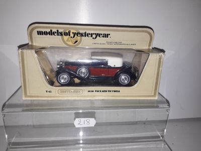 a model of a red car in a clear box