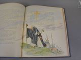 an open book with a picture of a man with a cross on it