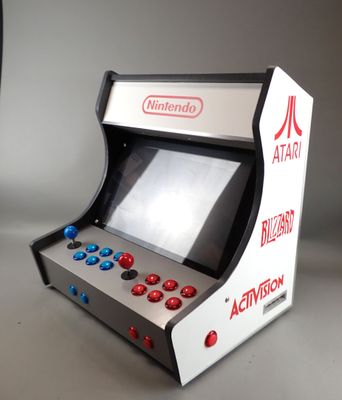 a small video game machine that is sitting on a table