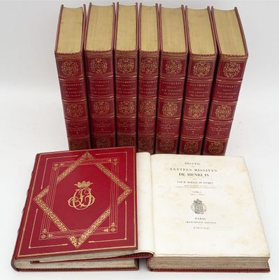 six red books sitting on top of each other on a white surface