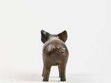 bronze figurine of a pig on a white background
