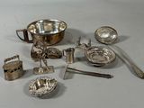 a lot of silver items that are on the table