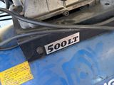 a close up of a blue air compressor on a table