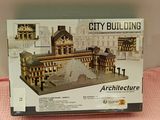 a box with a model of a city building on it