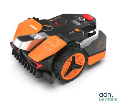 an image of a robotic lawn mower on a white surface