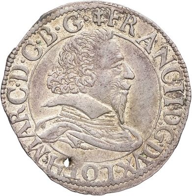 a silver coin with an image of a man on it