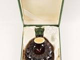 an image of a bottle of liquor in a box on a white surface