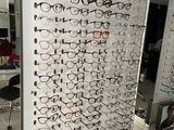 many pairs of glasses on display in a store