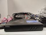 a black box with wires on top of it on a table