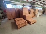 many boxes and pallets of wood in a warehouse