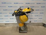 a close up of a machine on a stand in front of a wall