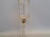 a wine glass sitting on a table with a white background