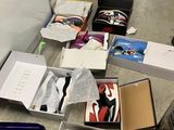 many boxes of shoes that are on the floor
