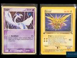 two pokemon cards are shown side by side on a black background