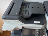 two printers sitting on top of each other in a room