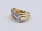 a close up of a gold and diamond ring on a white surface